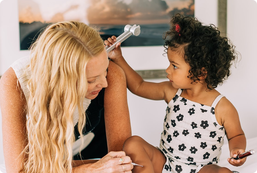 Mother and child using gentle healing tools